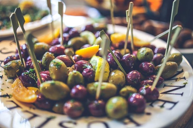 Alicante Wine Tasting and Tapas for Foodies - Walking between small local places