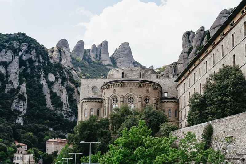 Barcelona: Montserrat and Winery Tour with Tapas or Lunch - Oller del Mas adds history, wine, and a slower pace