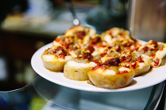 Barcelona Night Bike Tour with Local Tapas and Cava Stop - Casa Golferichs and the city’s lesser-known architecture