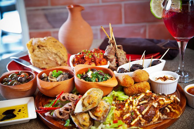 Barcelona Old Town Night Small Group Tour with Tapas & Flamenco - Starting at Plaça Catalunya after dark