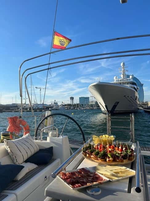 Barcelona: Sailing Tour with Tapas, Drinks and Swim Stop - Setting sail from Port Vell