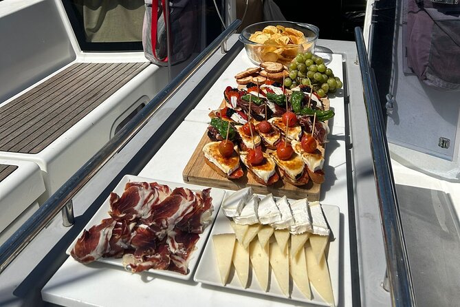 Barcelona: Sailing Tour with Tapas, Drinks, Swim & Sunset Option - The swim stop and open-water conditions