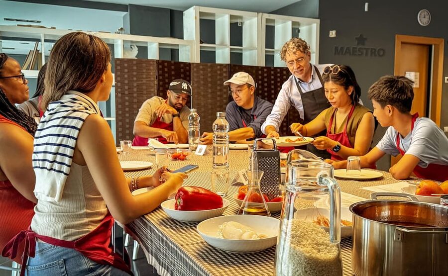 Barcelona: Seafood Paella ★Maestro★ & Tapas & Sangria - Making sangria with fresh fruit