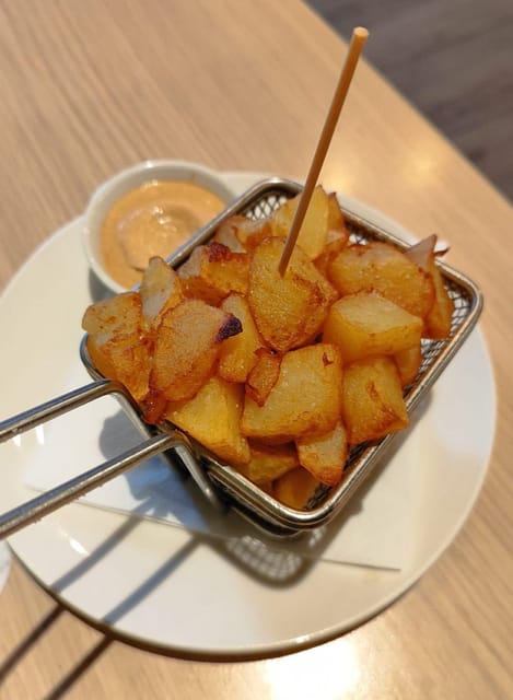 Barcelona: Tapas and Pintxos Tour with Crema Catalana - The neighborhood is part of the meal