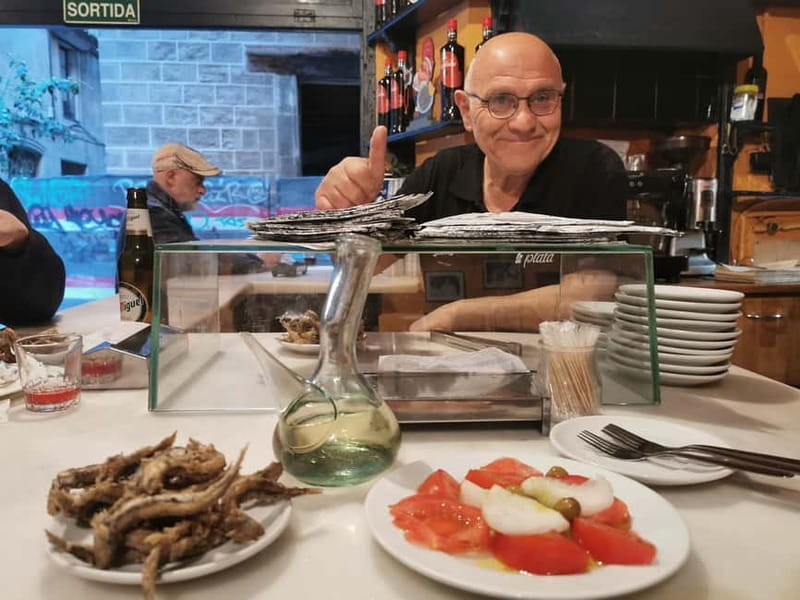 Barcelona: Tapas and Wine at the Hidden Bodegas Experience - Catalan tomato bread, ham, and the first plates