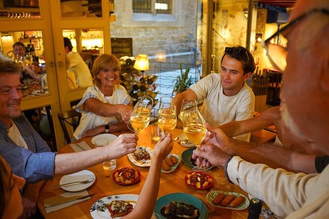 Barcelona Tapas and Wine Experience Small-Group Walking Tour - Walking toward El Born and Passeig del Colom