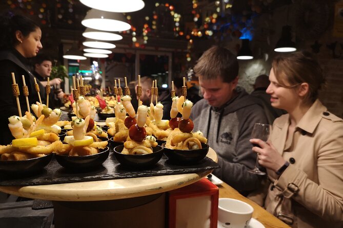 Barcelona Tapas & Wine Private Tour in Traditional Taverns - Stop two: Basque pinchos and patatas bravas