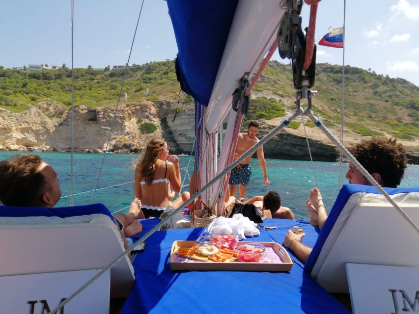 Can Pastilla: Sailboat Tour with Snorkeling, Tapas & Drinks - Swimming, snorkeling, and paddleboarding without pressure