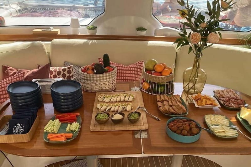 From Palma: Luxury Catamaran Group Tour with Tapas & Drinks - Four hours that balance sailing and swimming