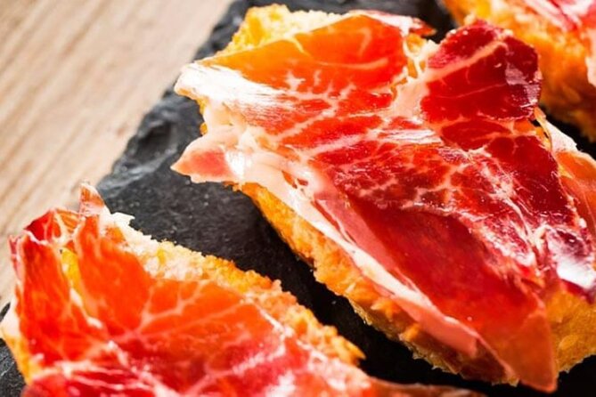 Gastronomic Tour: Discover the best “Wines and Tapas of Madrid” - Mercado Jamón Ibérico and Madrid’s prized cured ham