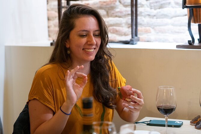 Gourmet Pintxos & Premium Wines small groups Food Tour - Walking into Plaza Nueva and Las Siete Calles