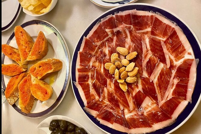 Half Day Private Madrid Tapas and History Walking Tour - Stop three: wine, tapas, and a shop full of bottles