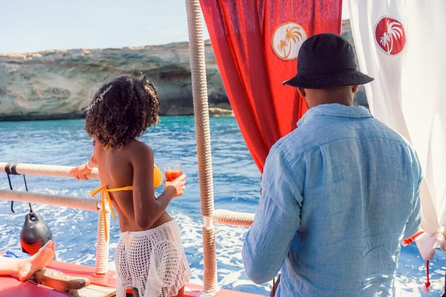 Ibiza: Secret Coves Guided Boat Tour with Open Bar and Tapas - What the crew adds to the day
