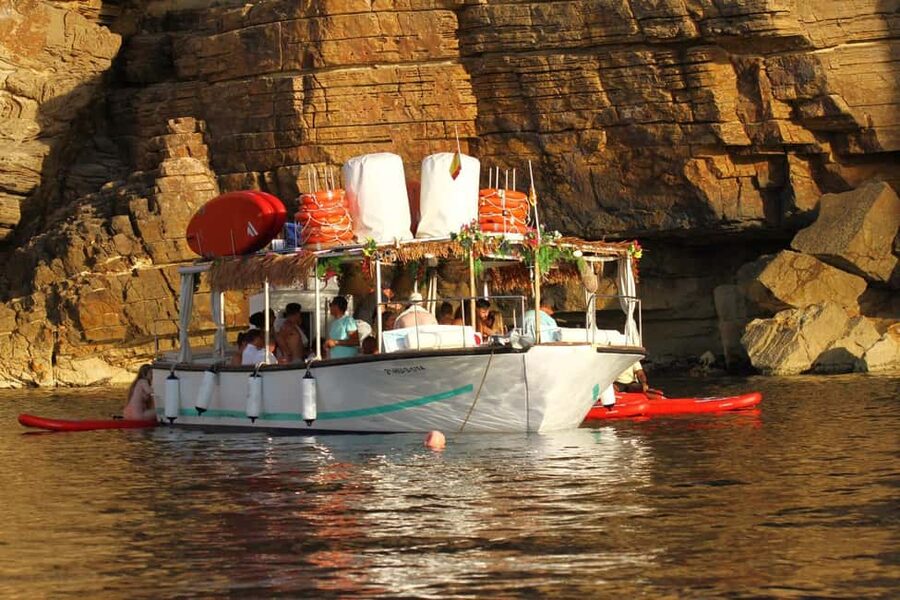 Ibiza: Sunset Boat Tour with Water Sports, Open Bar & Tapas - The Café del Mar sunset finish