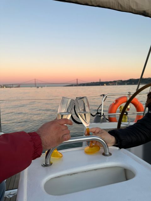 Lisbon: Romantic Cruise with Wine & Portuguese Tapas - Under the 25 de Abril Bridge