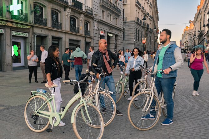 Madrid at Night: Vintage Bike Tour of City Highlights - Plaza de España and Cervantes
