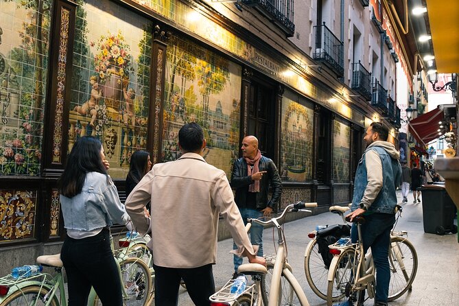 Madrid at Night: Vintage Bike Tour of City Highlights - Plaza Mayor and the famous squid sandwich