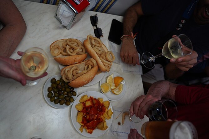 Madrid by Night: Tapas Crawl, Local Drinks & Hidden Gems - Plaza Mayor and Madrid’s famous calamari sandwich