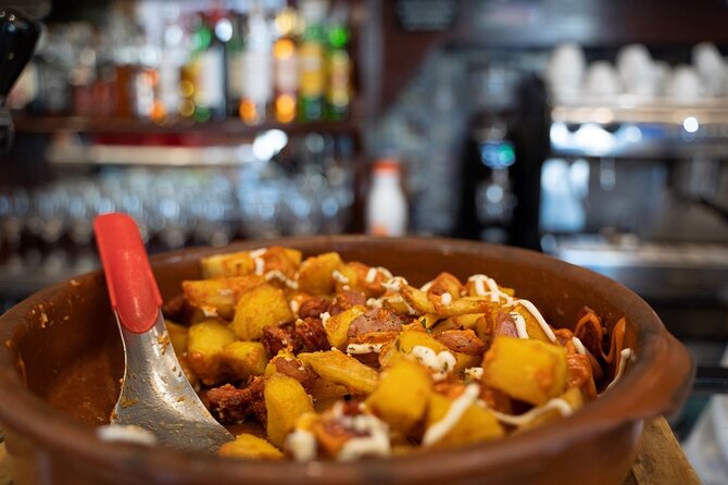 Madrid by Night: Tapas Crawl, Local Drinks & Hidden Gems - Ending near Puerta del Sol with dessert