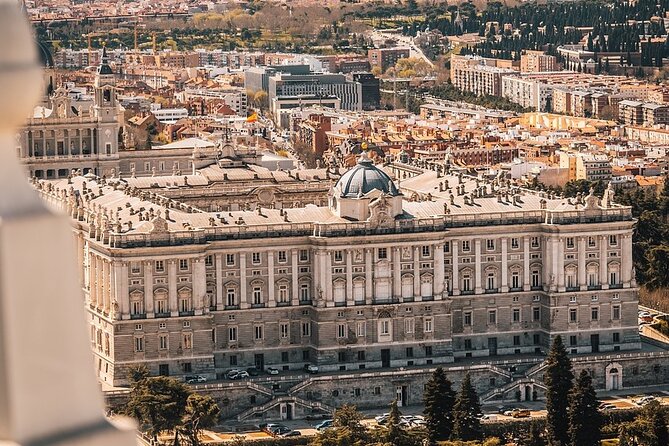 Madrid Food Tour: Tapas, Drinks and Delights with a Local - Madrid street art and a plate of cured meats
