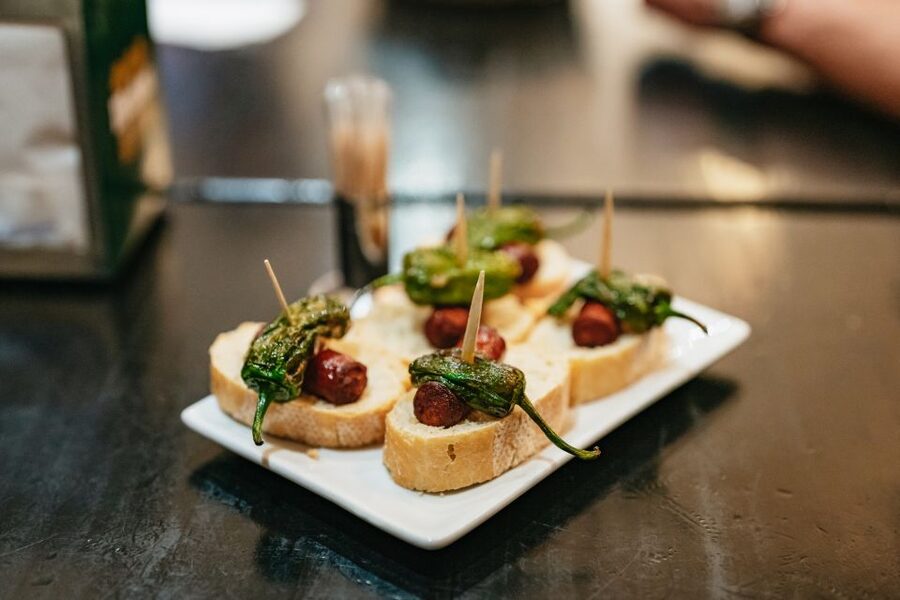 Madrid: Food & Wine Tour with 10 Tapas & 4 Drinks Included - Stop two: a neighborhood bar with local flavor