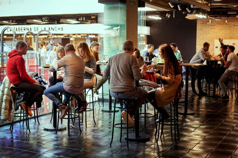 Madrid Gourmet Tour: Local Markets, Tapas & Wine - Starting Under the Spanish Flag at Plaza de Colón