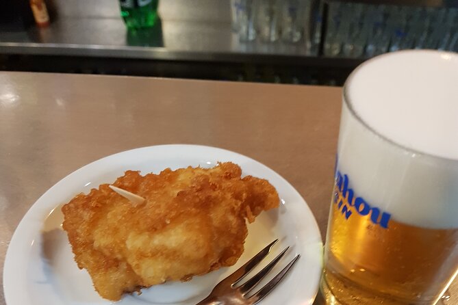 Madrid History Food Tour: Tapas & Drinks Tasting - Garlic shrimp, eggplant, and patatas bravas