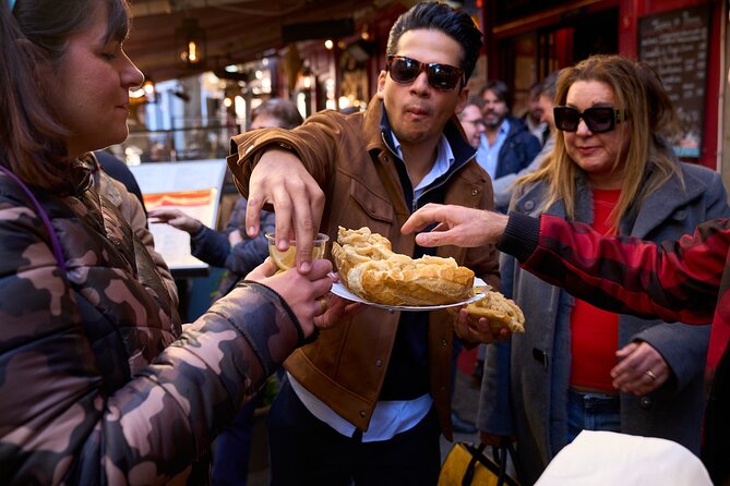 Madrid: Not Just Another Tapas & Wine Tour by Eating Europe - Mercado de San Miguel and the city’s food crossroads
