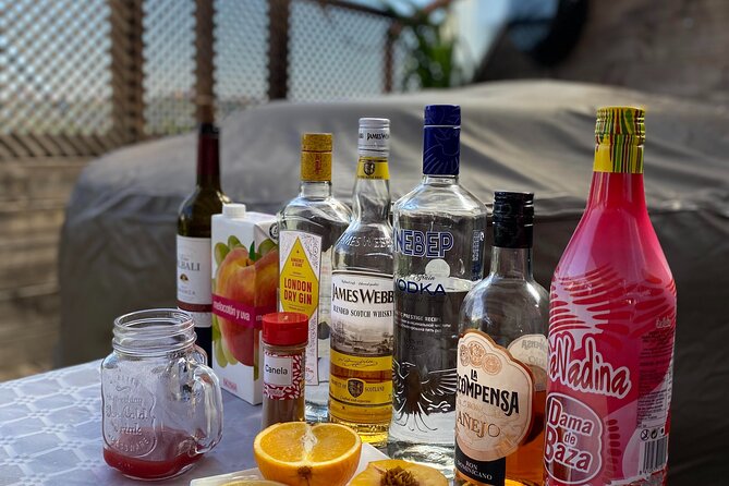 Madrid: Paella & Sangria Classes- Seafood, Chicken & Vegan option - Making traditional sangria before lunch