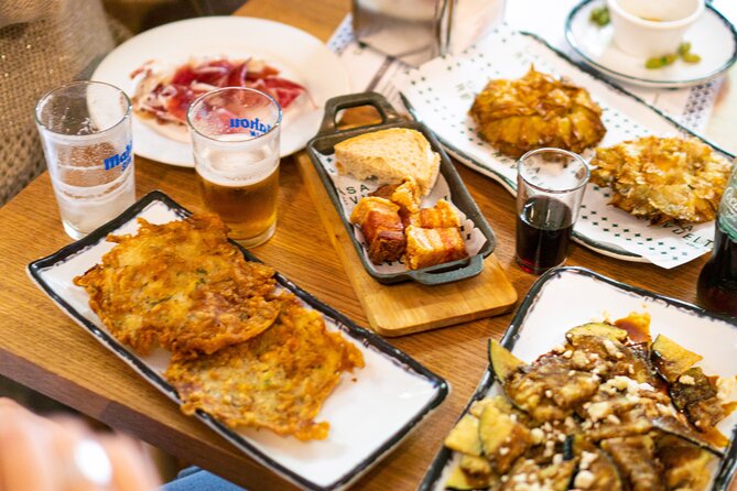 Madrid Tapas Tour with Food and Drink - Starting beneath Madrid’s bear and strawberry tree