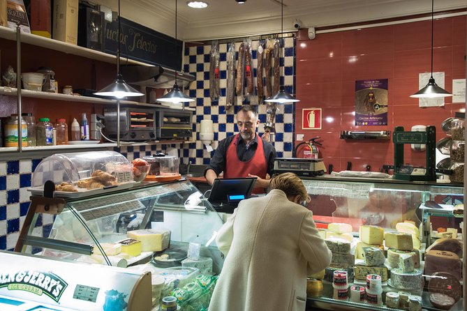 Madrid Tapas & Wine Tasting Walking Tour – Small Group Local Bars - Calle de la Cruz and the open kitchen