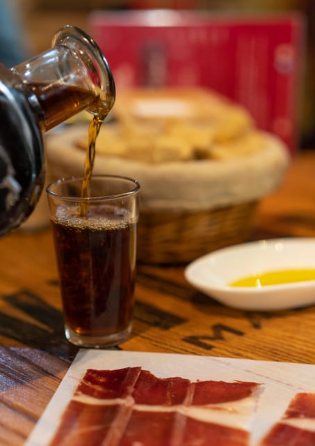 Málaga: Wine & Tapas Tour - Stop two: Iberian ham, market culture, and local shopping