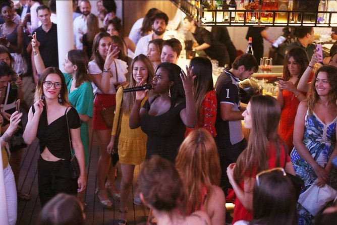 Nightlife Tour Drinks Tapas and Party Experience in Madrid - Calle de la Montera shows central Madrid in motion