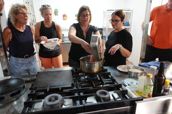 Paella & Sangria Class with Tapas and Market Visit - Eating the paella you helped prepare