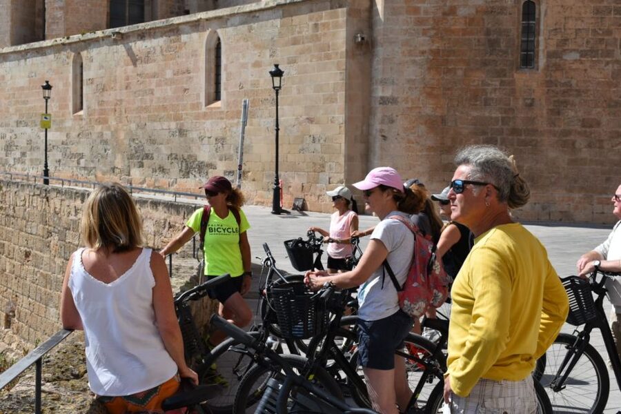 Palma de Mallorca: Guided Bicycle Tour with Tapas & a Drink - Reaching La Lonja and nearby neighborhoods