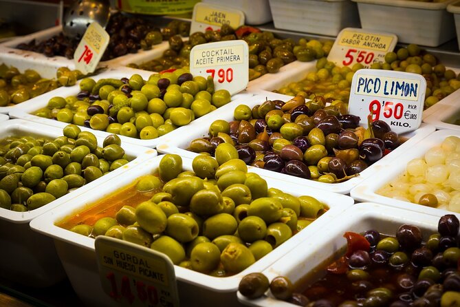 PREMIUM TAPAS TOUR: Paella, Market Tastings, and Winery - Reading Málaga through Atarazanas Market