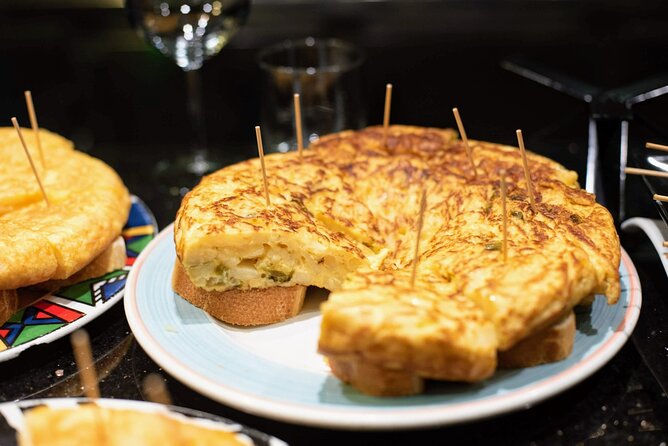 San Sebastian Centro Neighborhood Pintxos & Wine Tour - San Martín Market: cheese, fish, cider, and tortilla