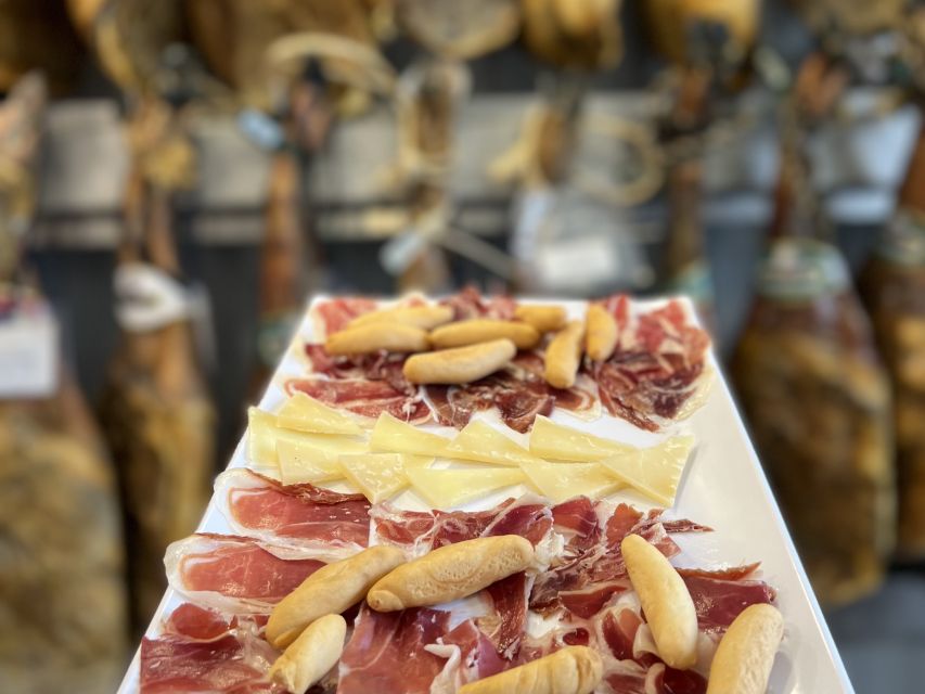 San Sebastian: Market, Pintxos and Wine Tasting Tour - Entering the old quarter, one bar at a time