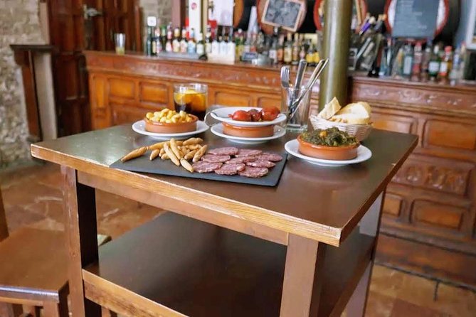 Sevilla Food Tour: Tapas, Wine, History & Traditions - Alfalfa, tostas, and a neighborhood tavern