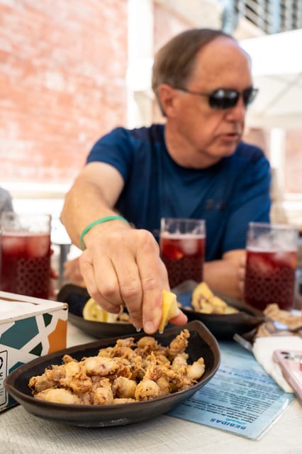 Seville Adventure: Historic Walking Tour & Traditional Tapas - Tapas in a traditional abacería
