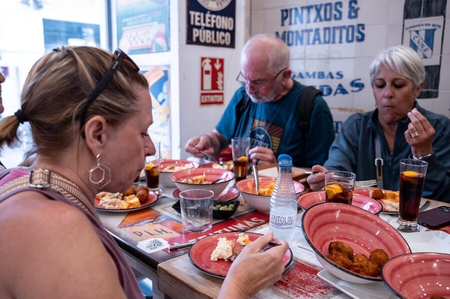 Seville Adventure: Historic Walking Tour & Traditional Tapas - The old tobacco factory and Seville’s grand avenue