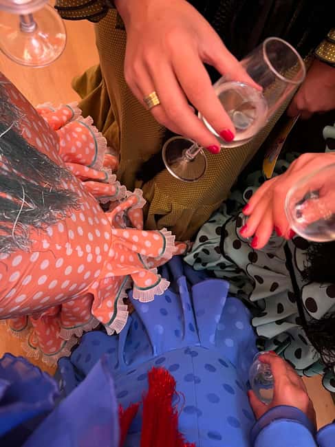 Seville: April Fair Guided Walking Tour with Tapas & Drinks - Clothing, bags, and access