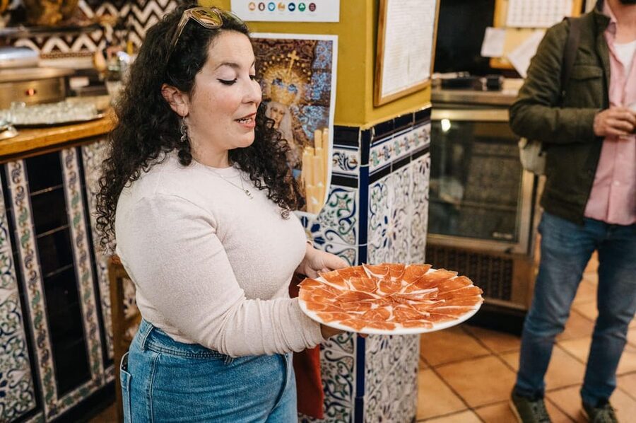 Seville: Private Tapas & History Tour in Triana Neighborhood - Iberian pork and a local red wine cocktail