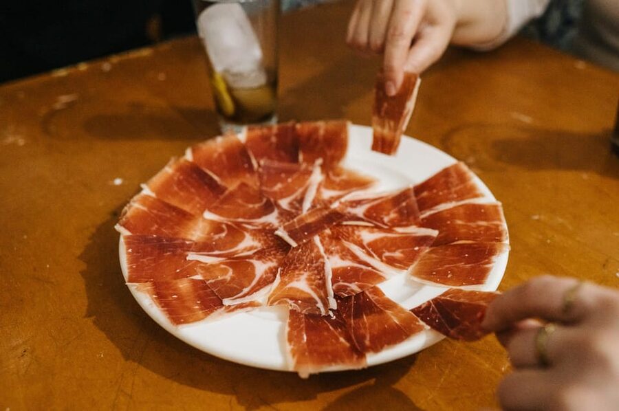 Seville: Private Tapas & History Tour in Triana Neighborhood - What four drinks and eight tapas really mean