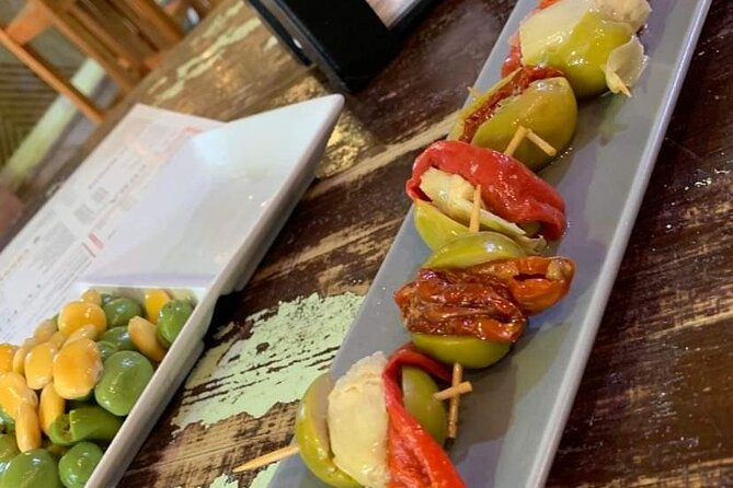 Seville Vegan Tapas Food and Market Walking Tour - Walking beside the Guadalquivir