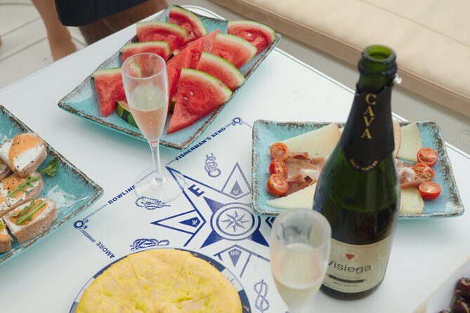 Shared Luxury Yacht Cruise with Champagne and Tapas - Swimming, Snorkeling, and Sea Scooters