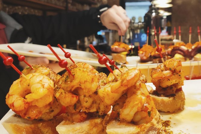 Spanish Wine and Tapas Tour in a Local Neighborhood in Barcelona - Four bars, four wines, and several kinds of tapas