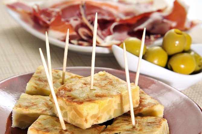 Tapas and Flamenco Show Small Group Tour in Barcelona - El Born, cured ham, and Manchego cheese