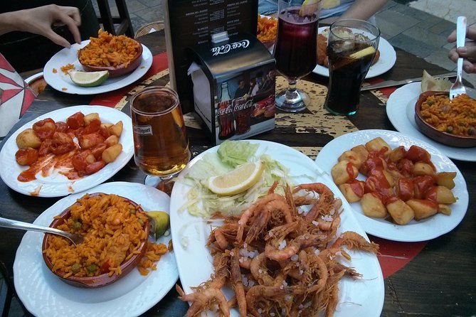 Tapas and Wine Tasting Tour in Seville Small Groups and Jewish Quarter - Through Barrio Santa Cruz and the old Jewish Quarter