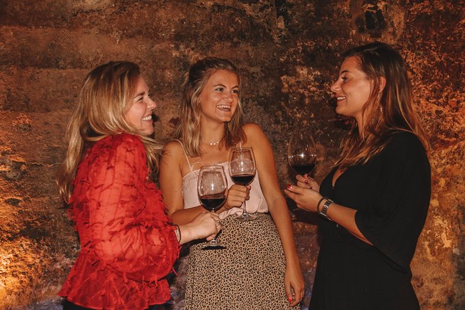 Valencia Old Town Tour with Wine & Tapas in 11th Century Historic Monument - Barrio del Carmen: from walking shoes to a long table